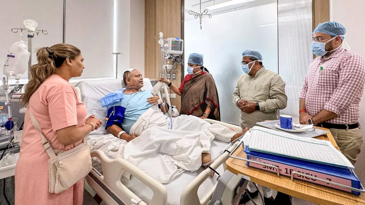 Delhi Chief Minister Rekha Gupta meets a person injured in the Malviya Nagar fire incident. Pic/PTI